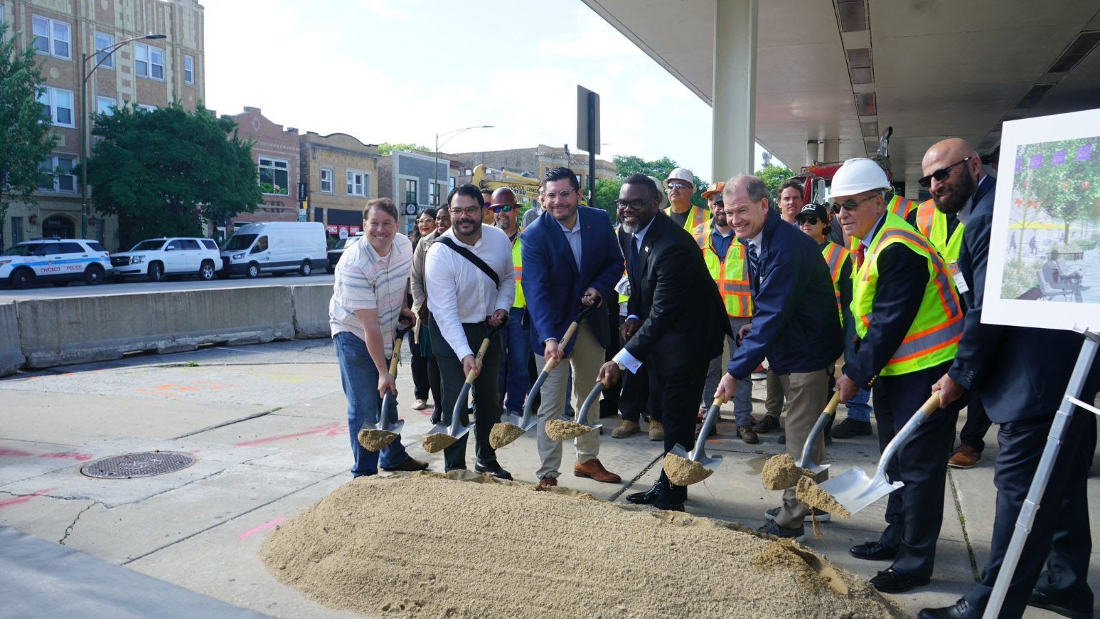 Logan Square Presrvation President Andrew Schneider breaks ground with Chicago Mayor Brandon Johnson