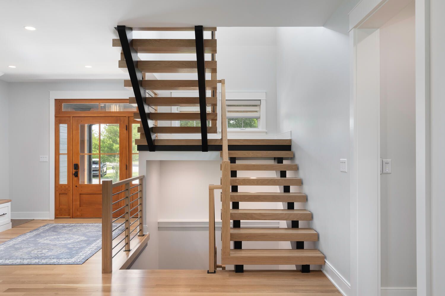 Custom home staircase, entryway,  hardwood floors in Plainfield, Illinois.  Custom home in Hinsdale Elmhurst Naperville.