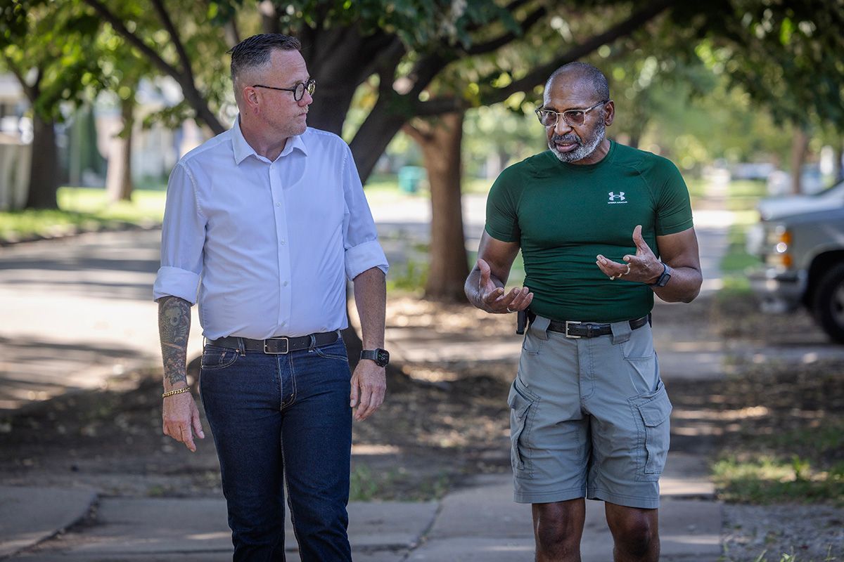 Senator Silas Miller walking the neighborhood with a constituent