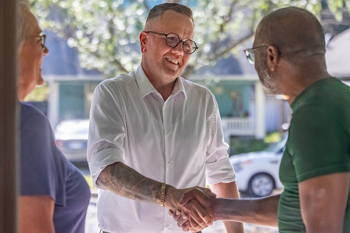 Senator Silas Miller greeting a constituent at the door