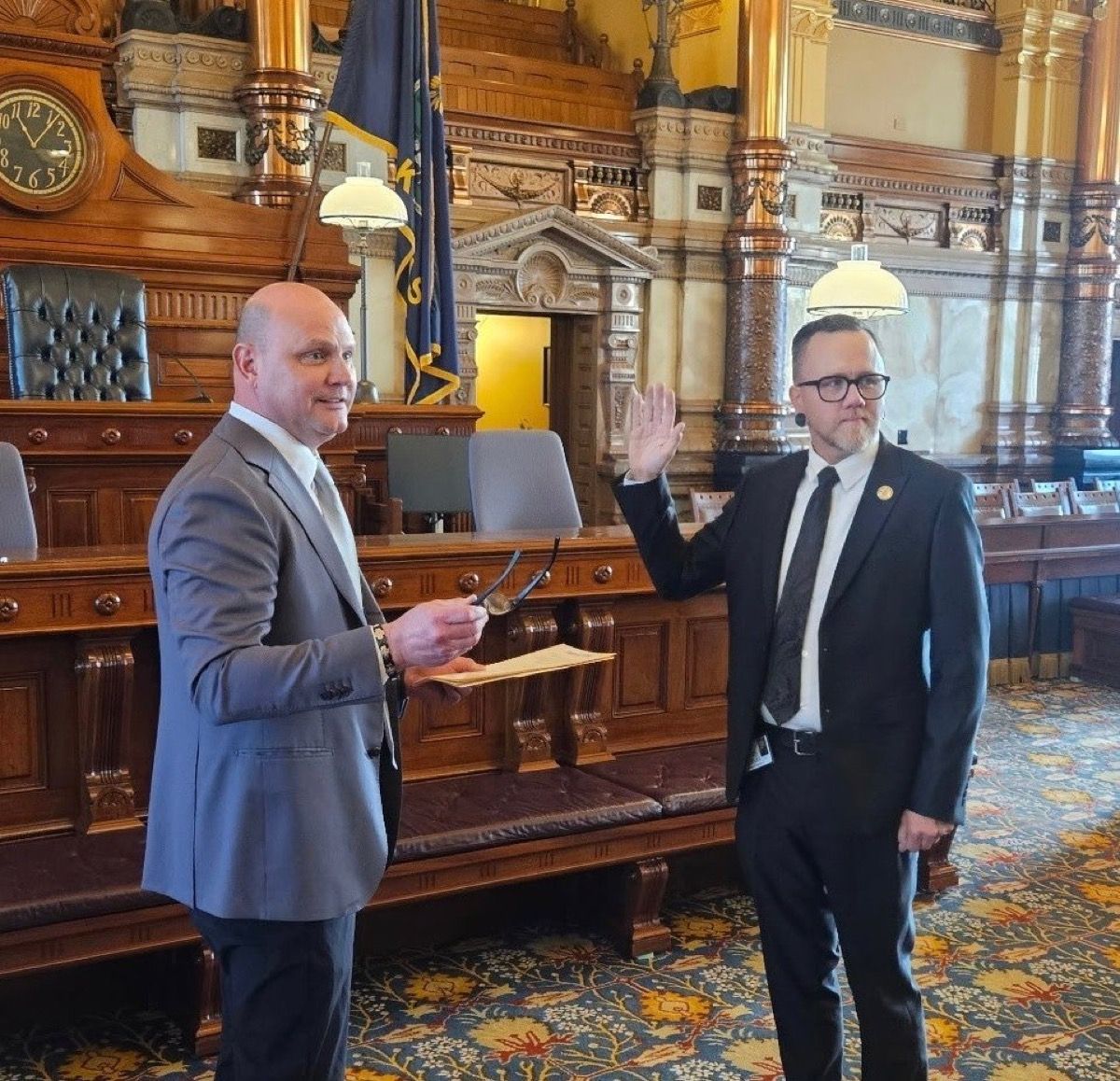 Silas Miller taking the oath of office in the Kansas Senate chamber