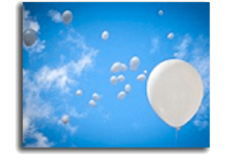 White balloons floating in a bright blue sky with scattered clouds