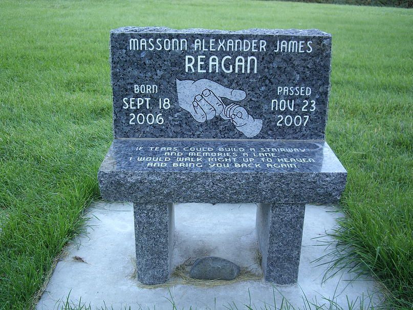 Gravestone for Masson-Flexander James Reagan in a grassy cemetery