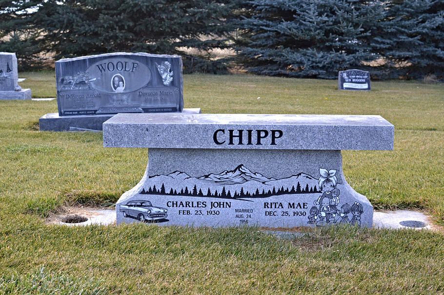 Two gray gravestones on a grassy cemetery lawn, one marked “CHIPP” in front.