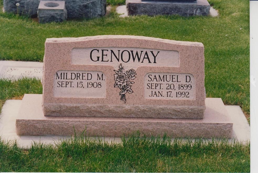 Genoway family gravestone in a grassy cemetery, with engraved names and dates.