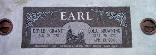 Gray memorial plaque labeled “EARL” with two engraved names and dates, mounted with screws