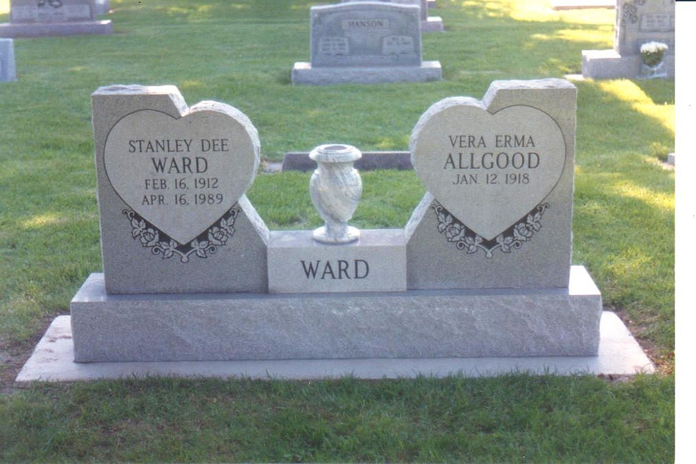 Two gray gravestone markers in a cemetery with the name WARD on the base
