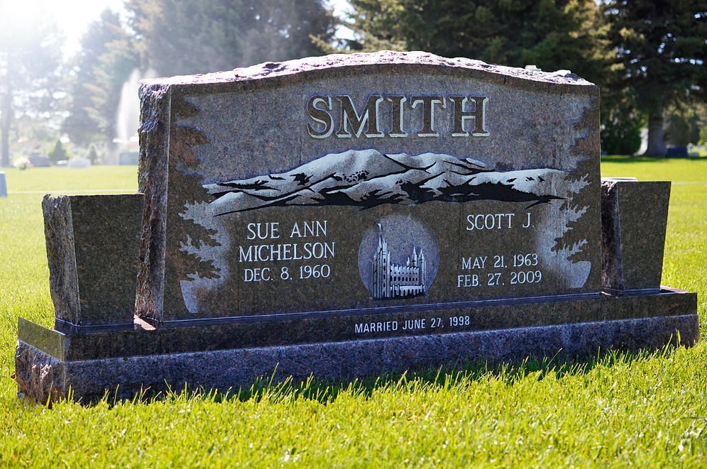 Smith family gravestone in a sunny cemetery, with engraved names and a large eagle carving