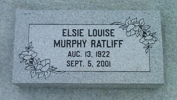 Gray memorial stone engraved “ELSIE LOUISE MURPHY RATLIFF,” with dates Aug. 13, 1922 and Sept. 5, 2001, and floral carvings.