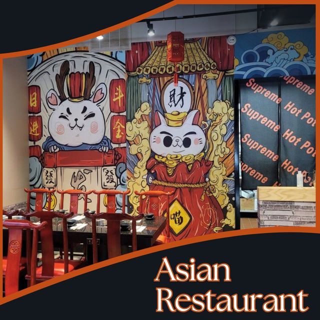Asian restaurant interior with colorful rabbit mural and lantern decor, featuring red and black accents