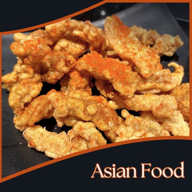 Crispy golden fried chicken pieces on a dark tray with “Asian Food” text in the corner