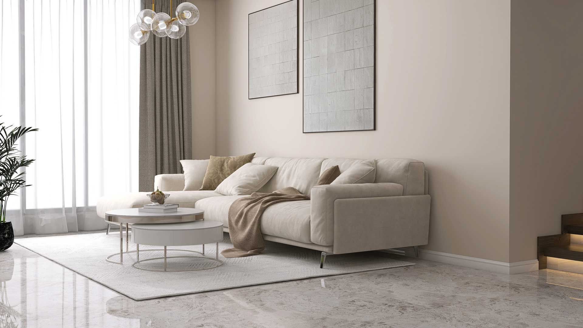 A living room with a couch , coffee table , and stairs.