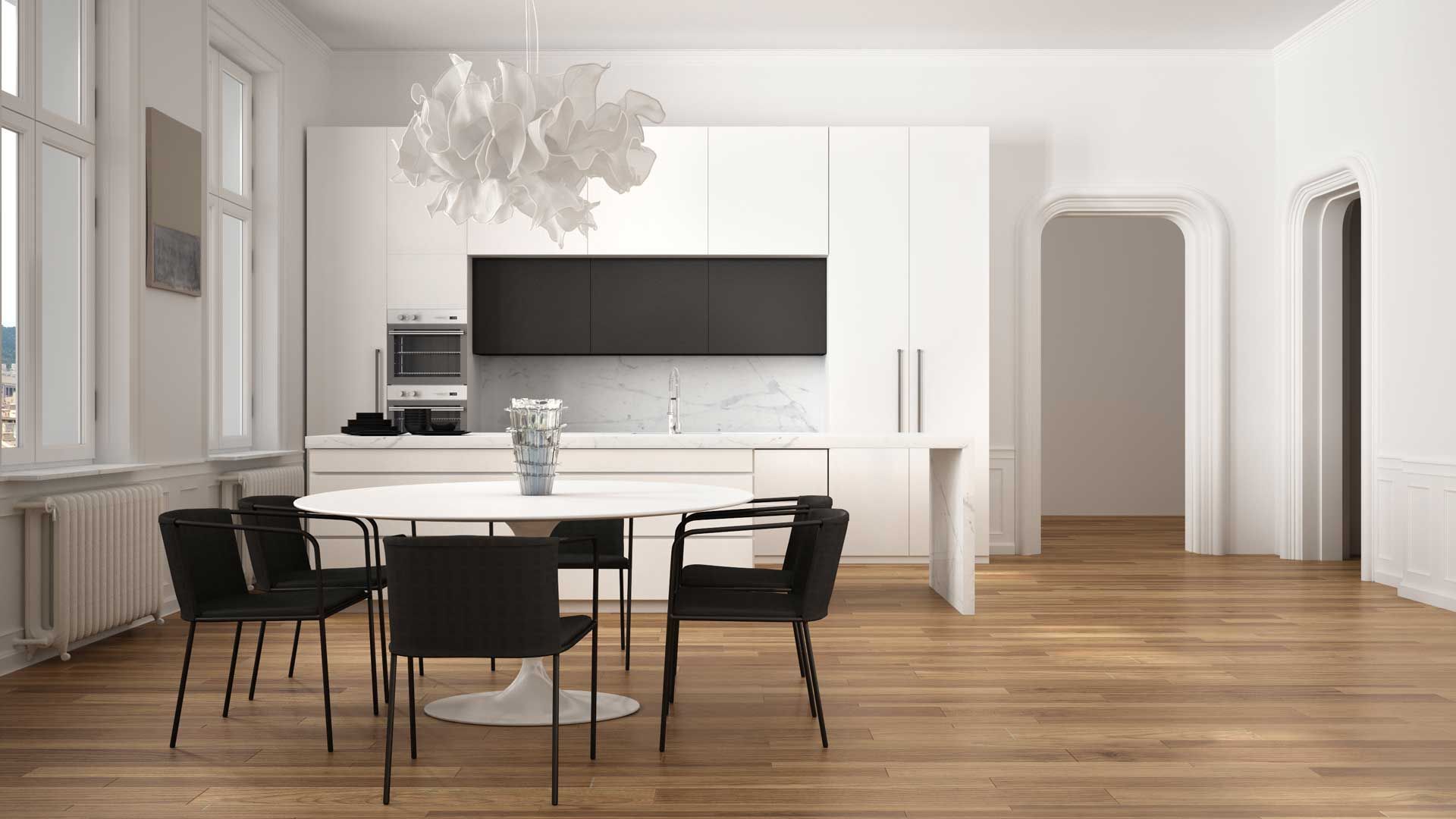 There is a dining table and chairs in the kitchen.