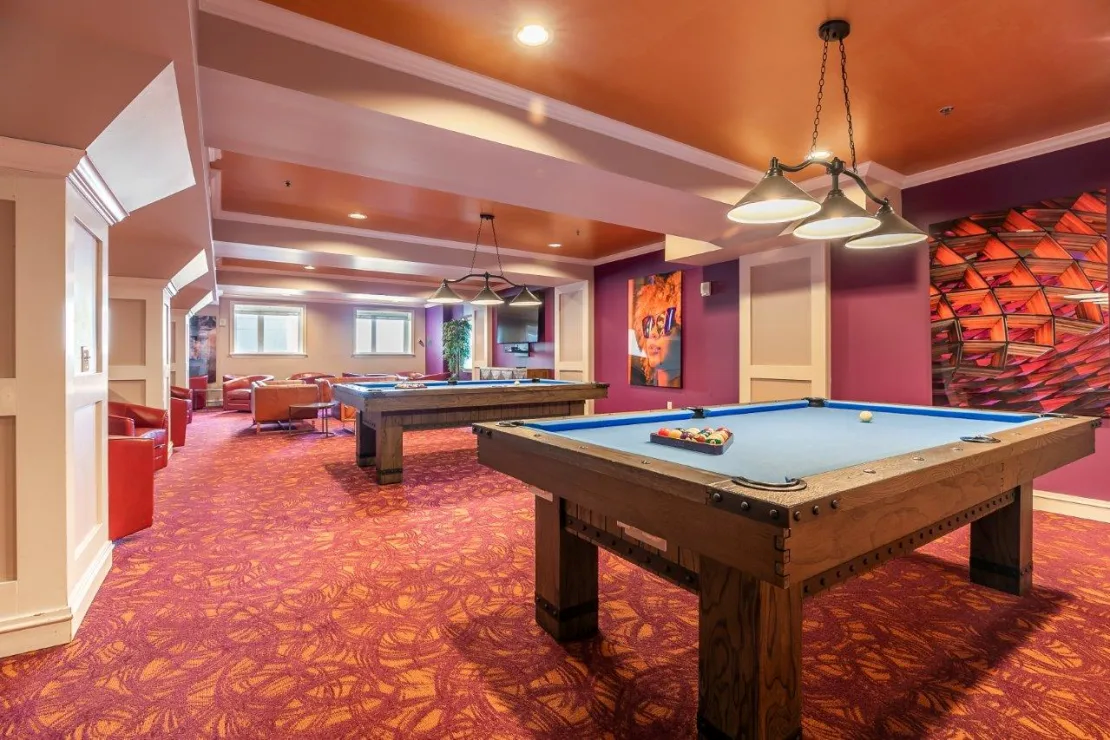 There are two pool tables in the room.