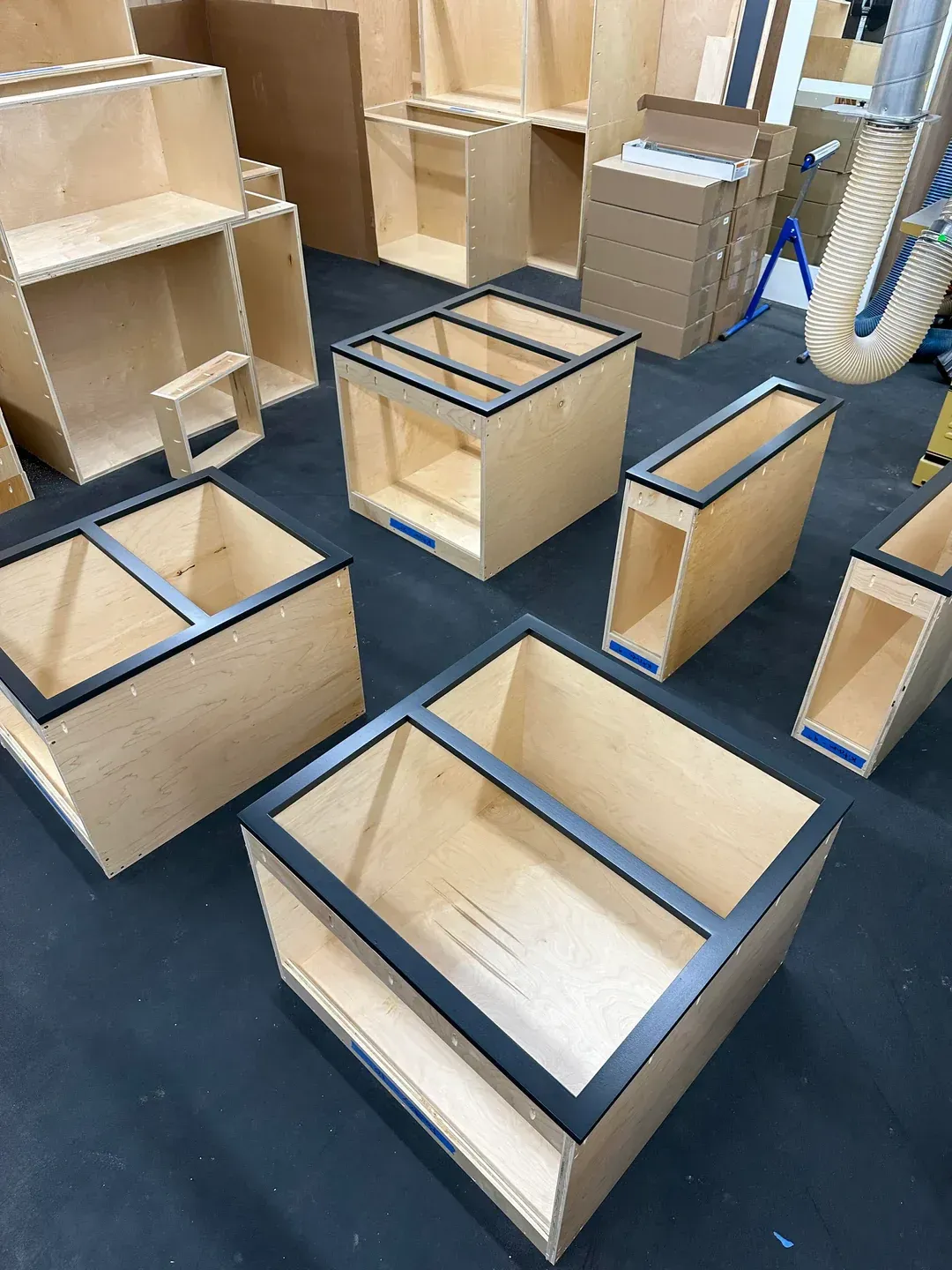 A bunch of wooden boxes are sitting on a table.