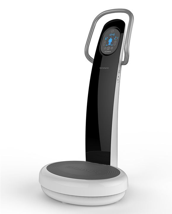Compact black-and-white exercise machine with a digital display and oval padded base