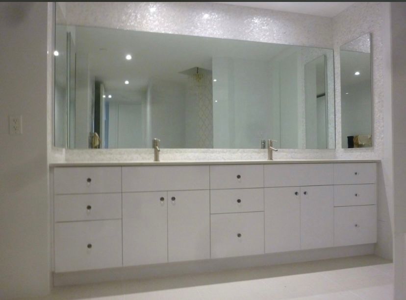 Double sink vanity with quartz countertop and large mirror