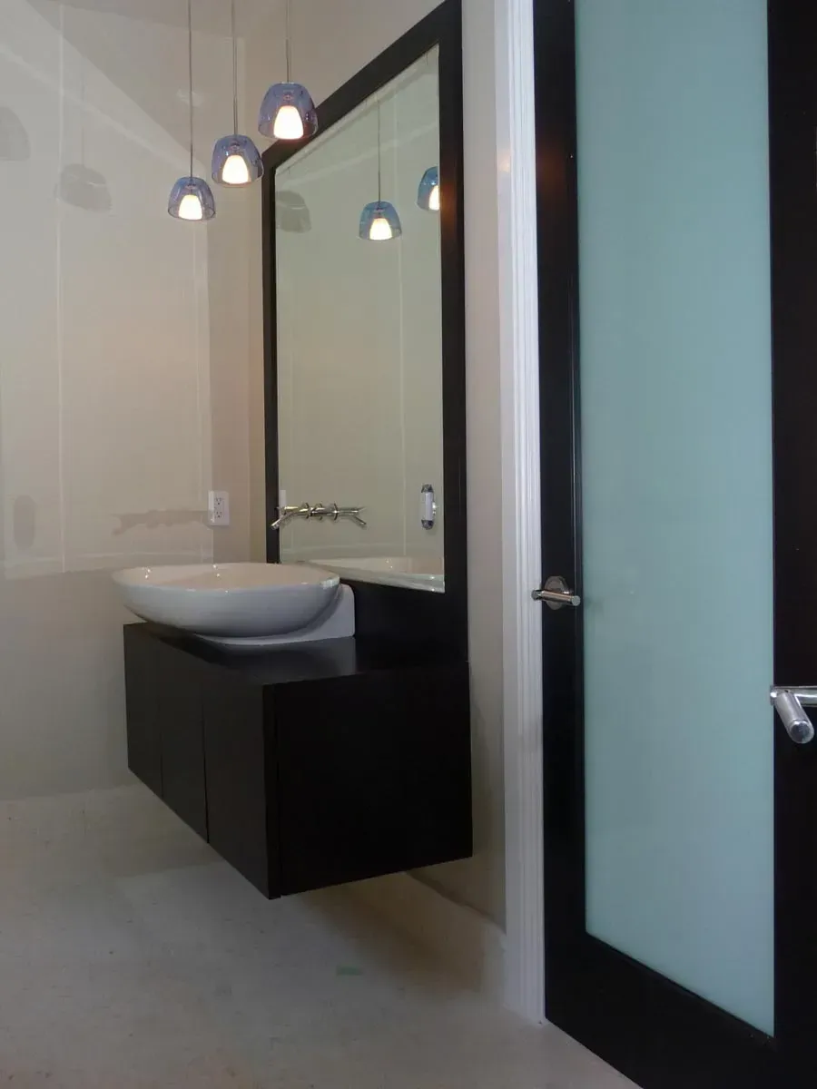 Custom wall hung bathroom vanity with vessel sink and mirror | Aventura, FL