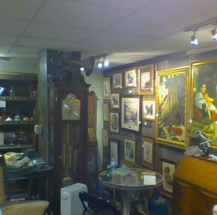 A room with a table and a clock on the wall