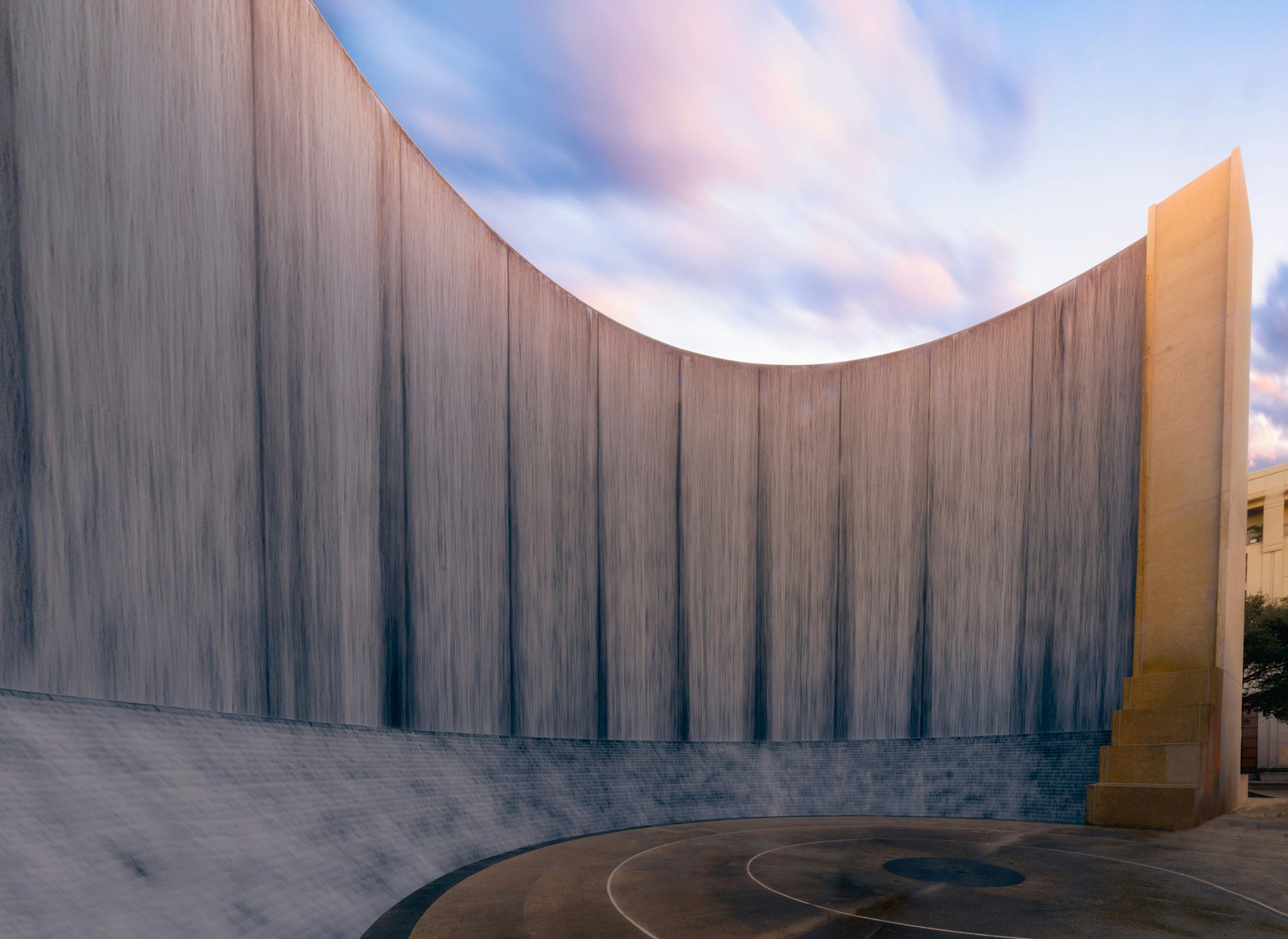An artist 's impression of a waterfall in front of a building