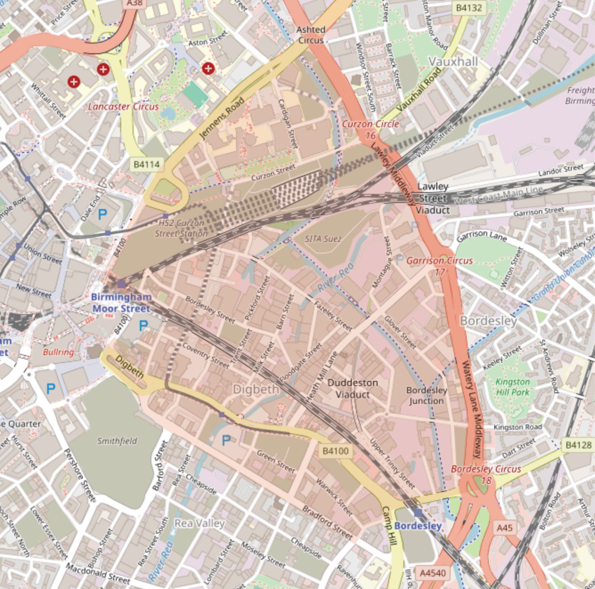 Map outline of a region, tinted pink, with roads and buildings visible within the borders.