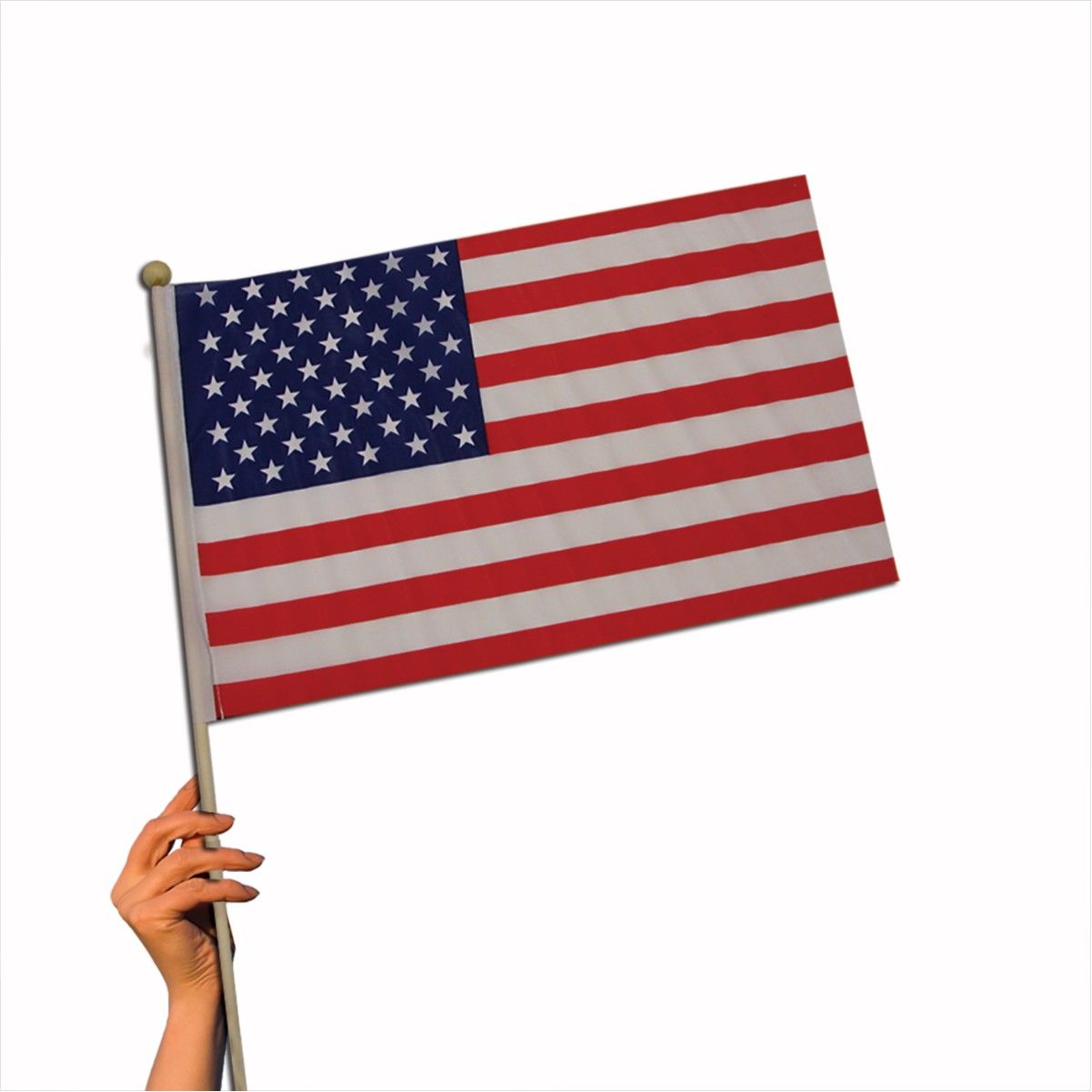 A hand is holding an american flag on a pole