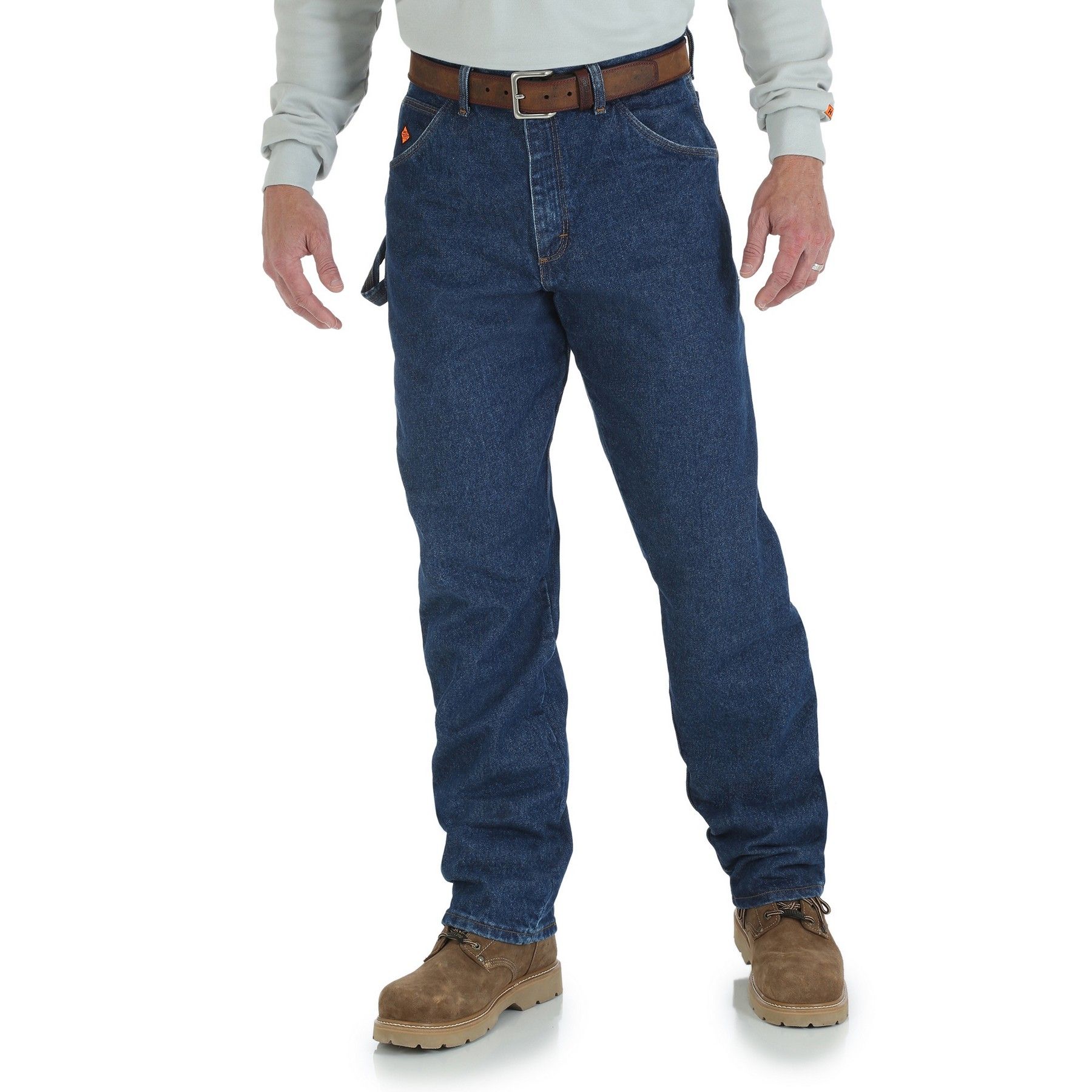 A man wearing a white shirt and blue jeans