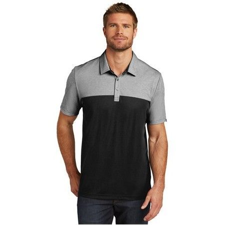 A man is wearing a black and grey polo shirt.