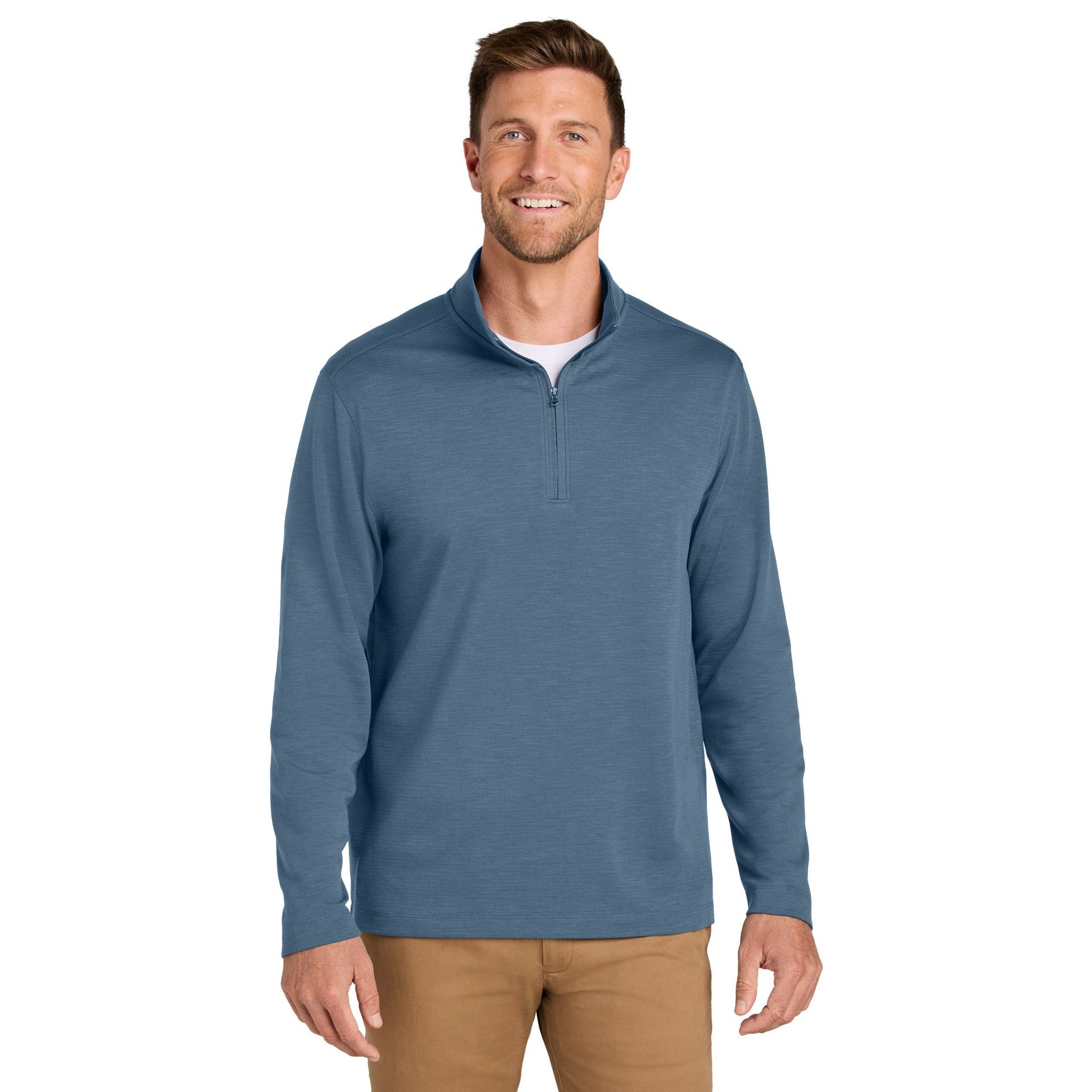 A man is wearing a blue sweater and brown pants.