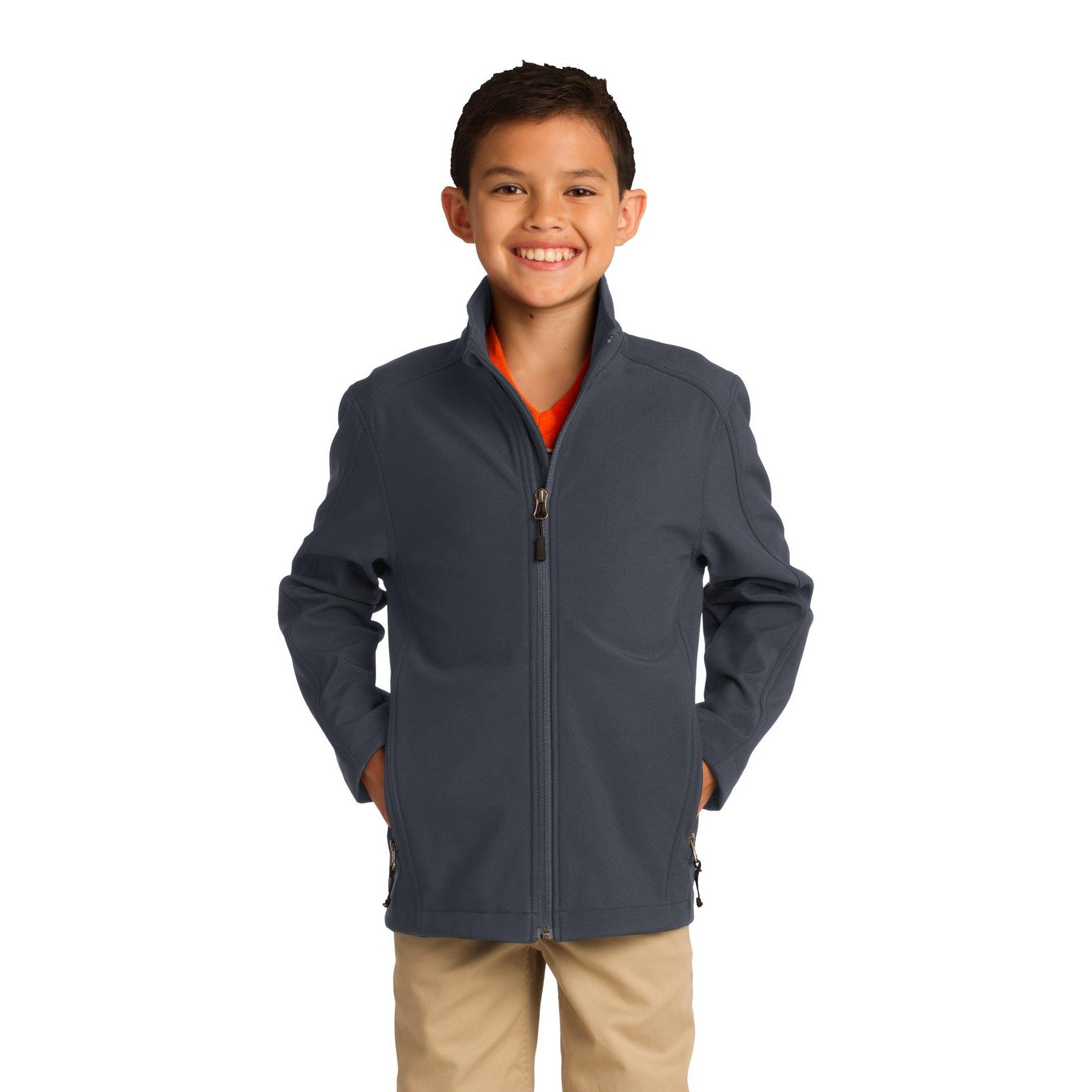 A young boy wearing a blue jacket and khaki pants