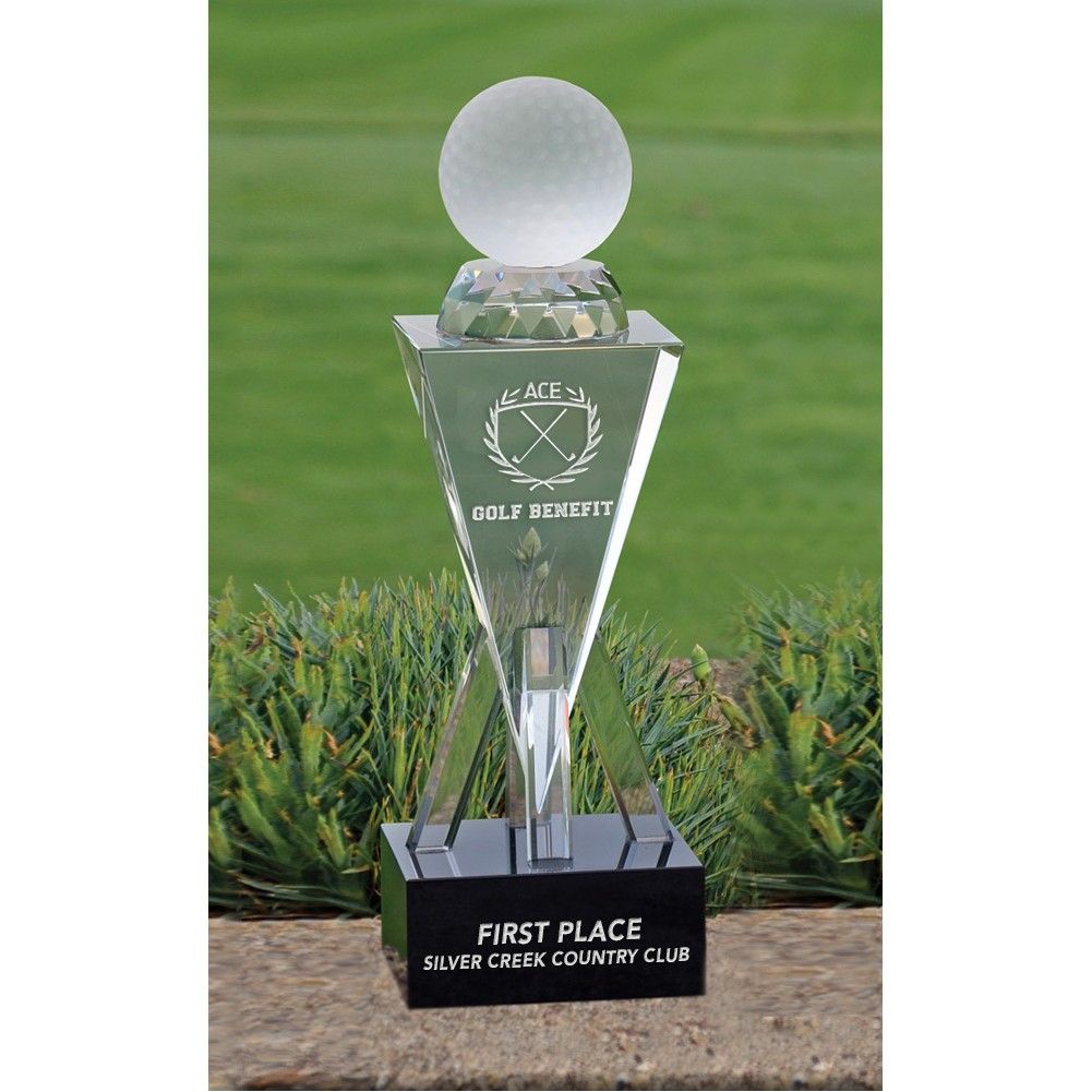 A glass trophy that says first place on it