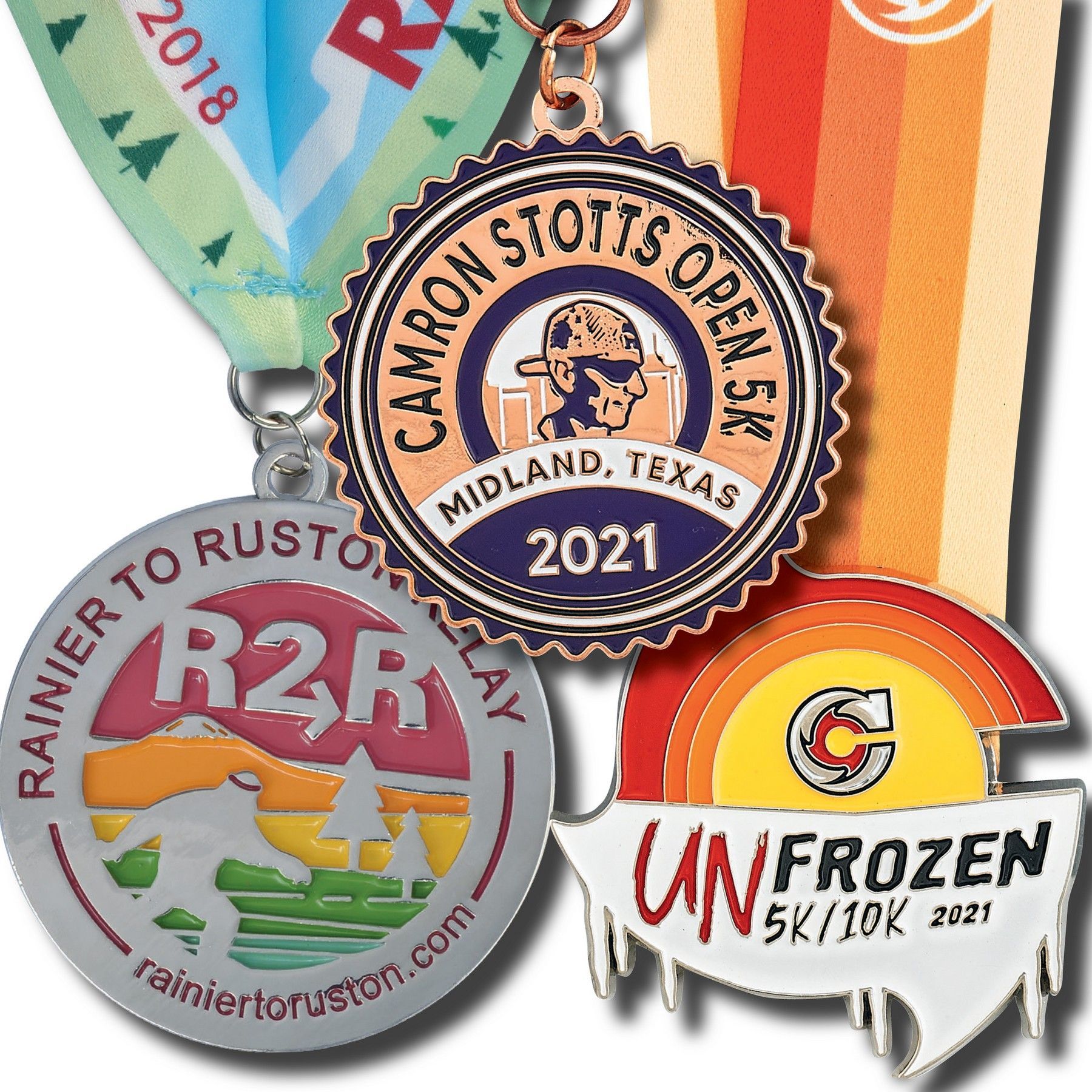 A group of medals are sitting next to each other on a white background.