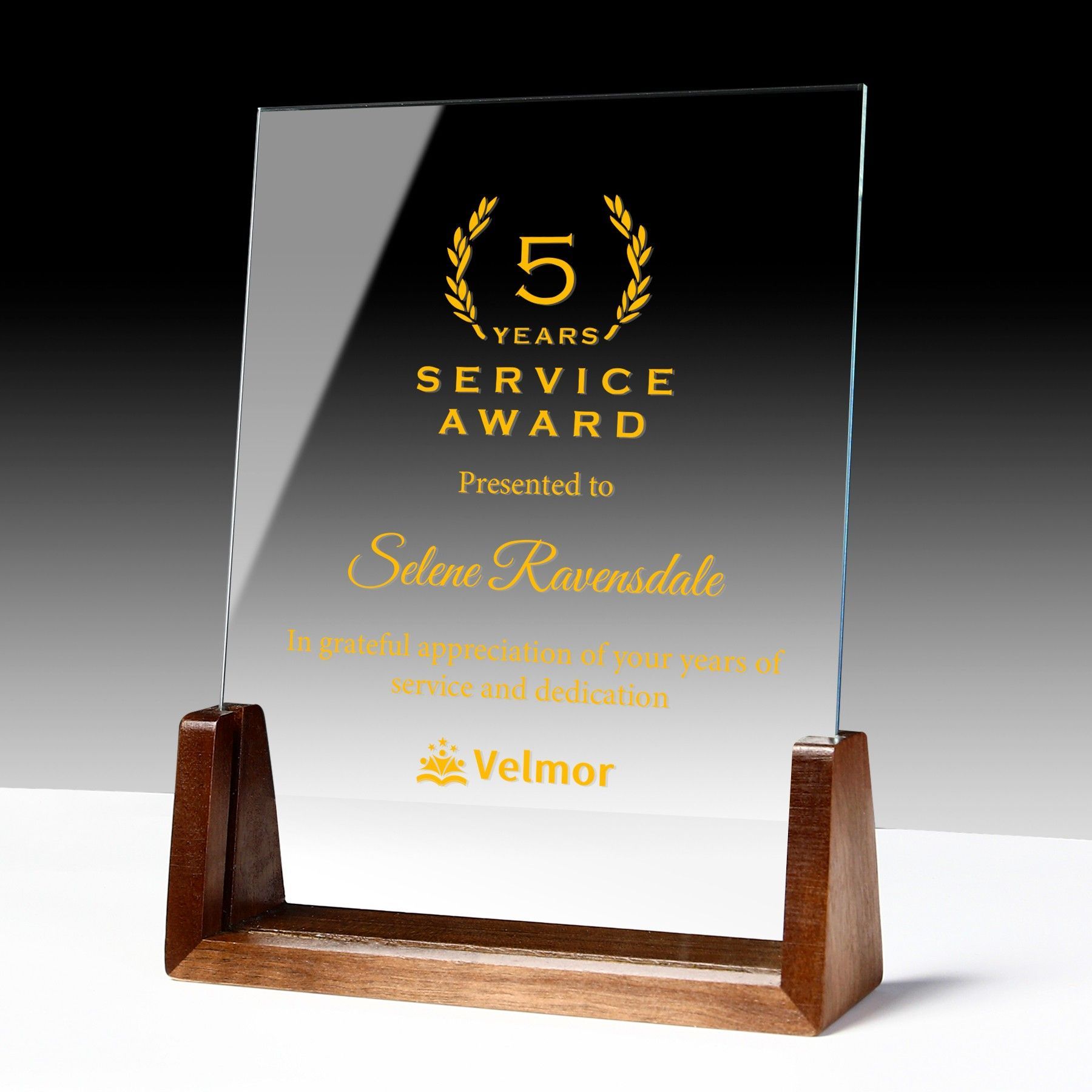 A 5 years service award presented to selena ravensdale