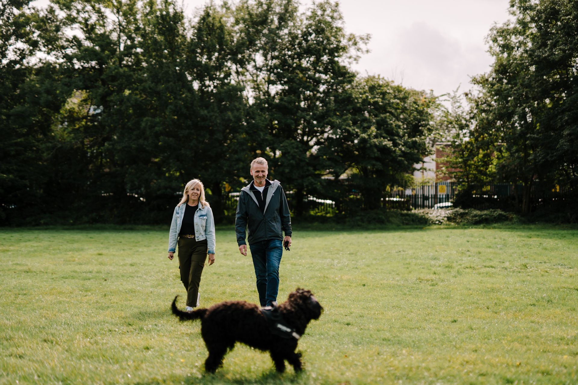 A couple walking their dog