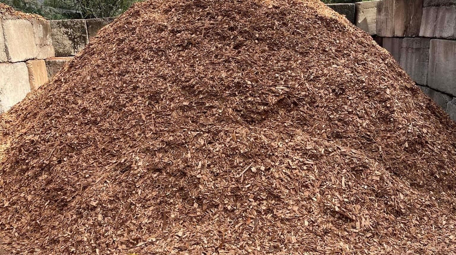 Pile of Brown Cypress Chips — Campbell's Truck and Bobcat and Landscape Supplies In Gympie, QLD