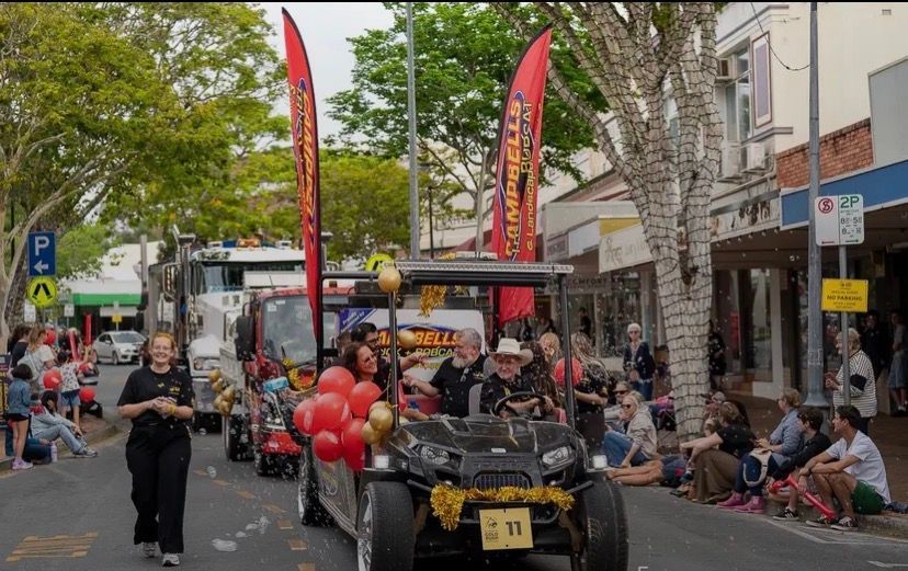 A Man is Cutting a Cake — Campbell's Truck and Bobcat and Landscape Supplies In Gympie, WLD