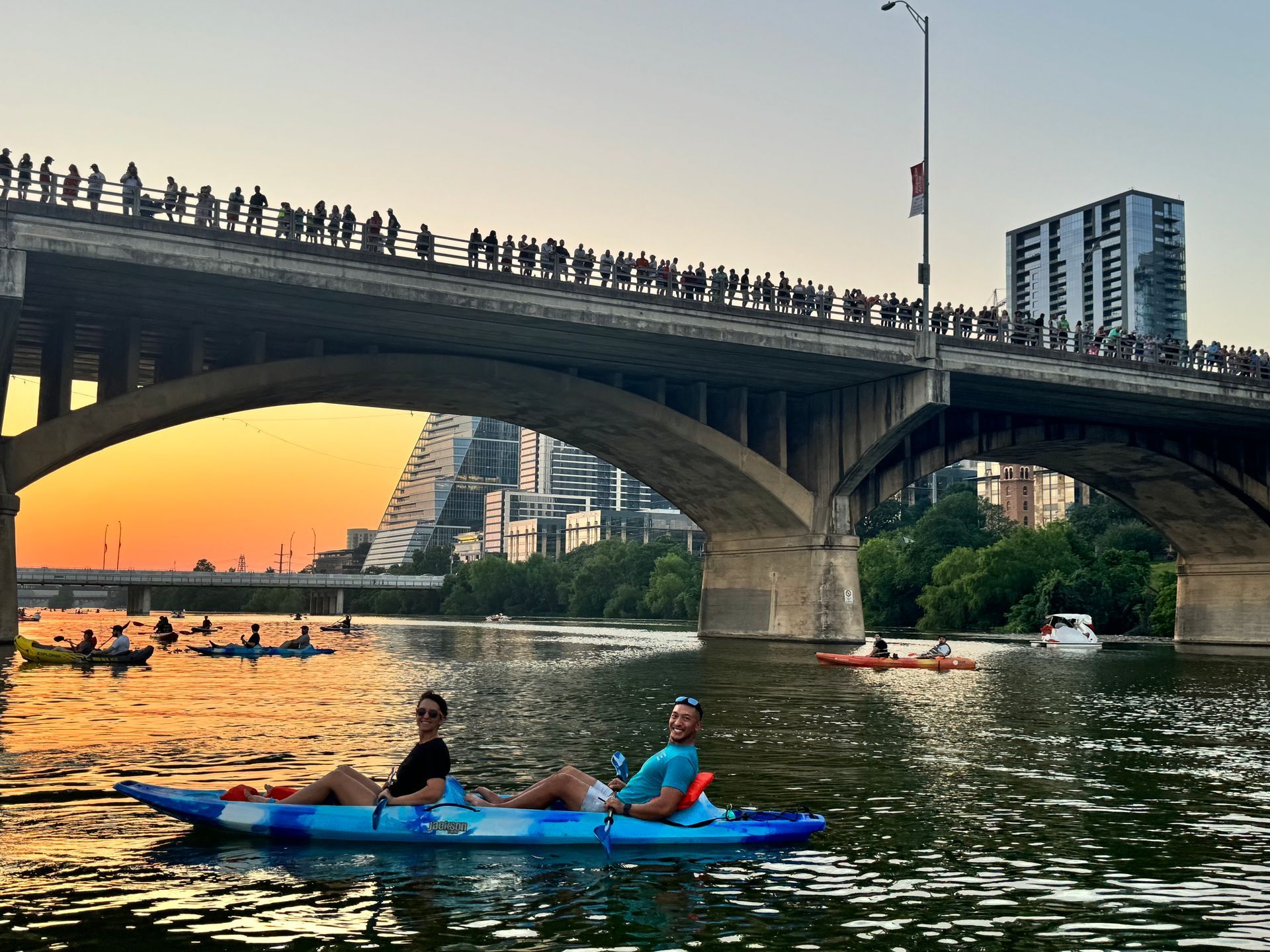 Guest capturing golden hour sunset from paddleboard on Lady Bird Lake