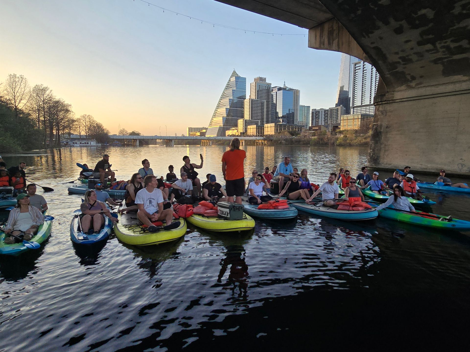 Kayak tour group preparing to launch paddleboards for sunset tour in Austin