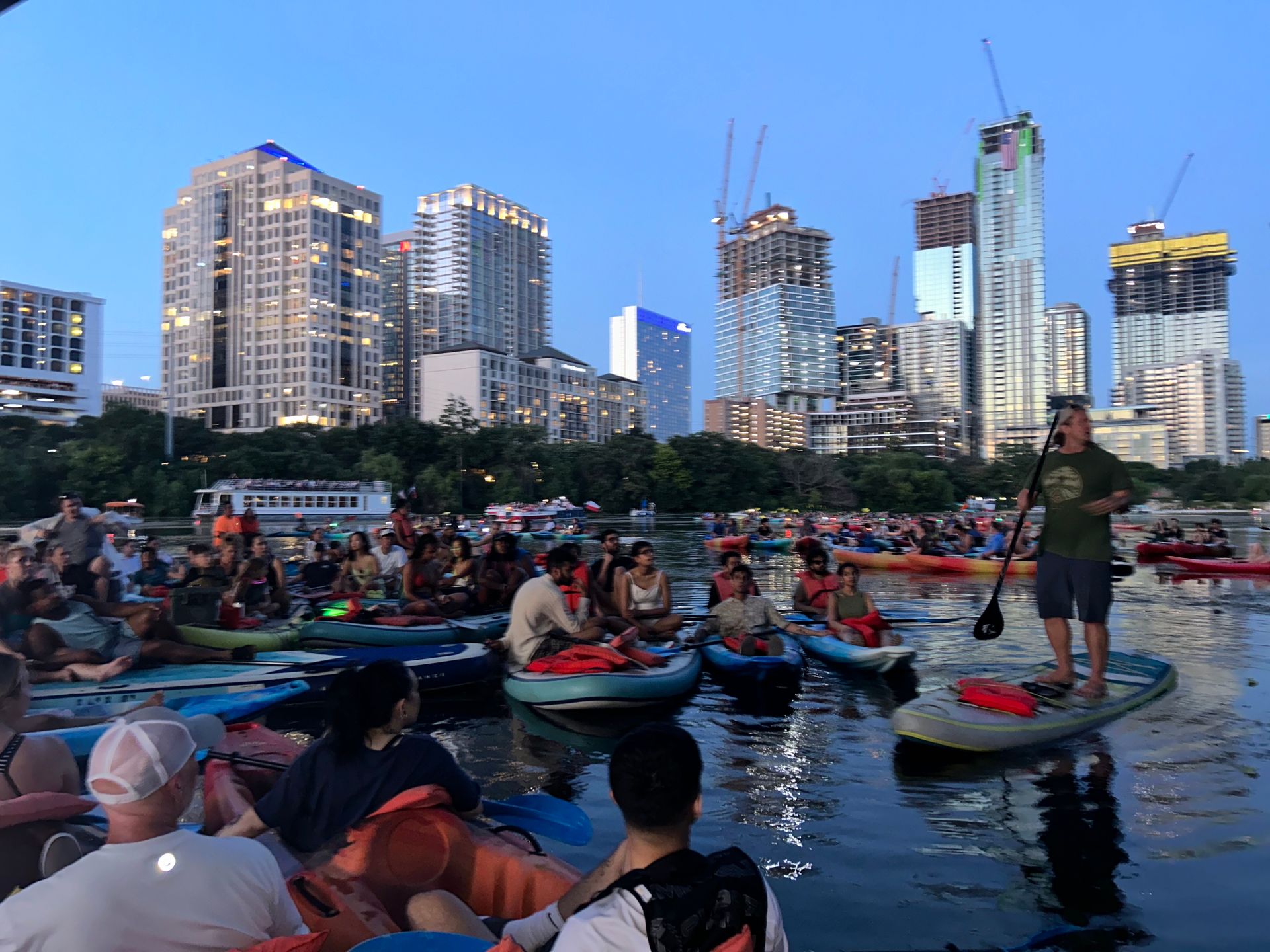 Boats and bats guided tour with all participants under the Congress Ave bridge