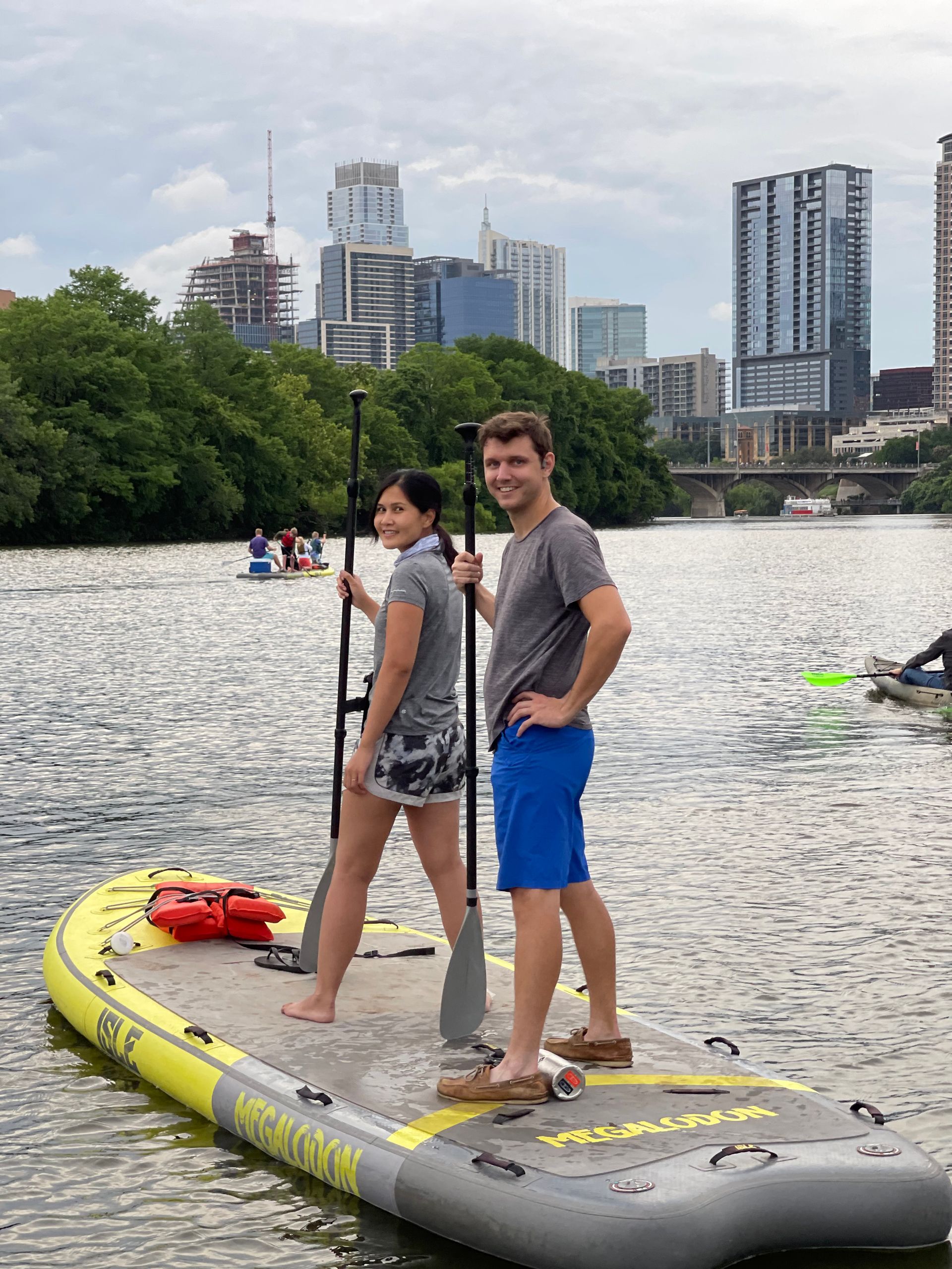 Person balancing on a paddleboard, demonstrating coordination and stability on Lady Bird Lake.