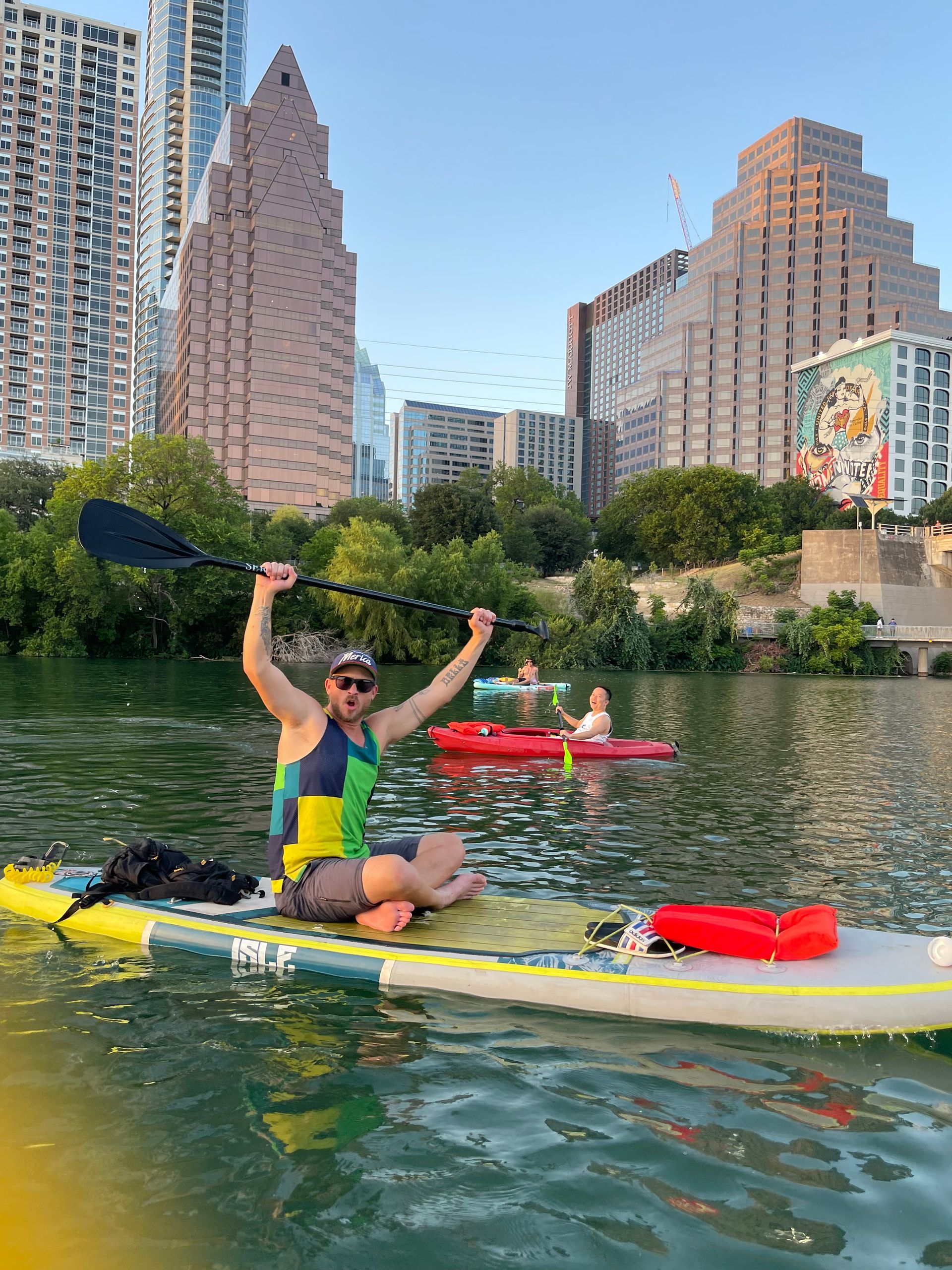 Paddleboarder on Lady Bird Lake watching bat emergence in Austin