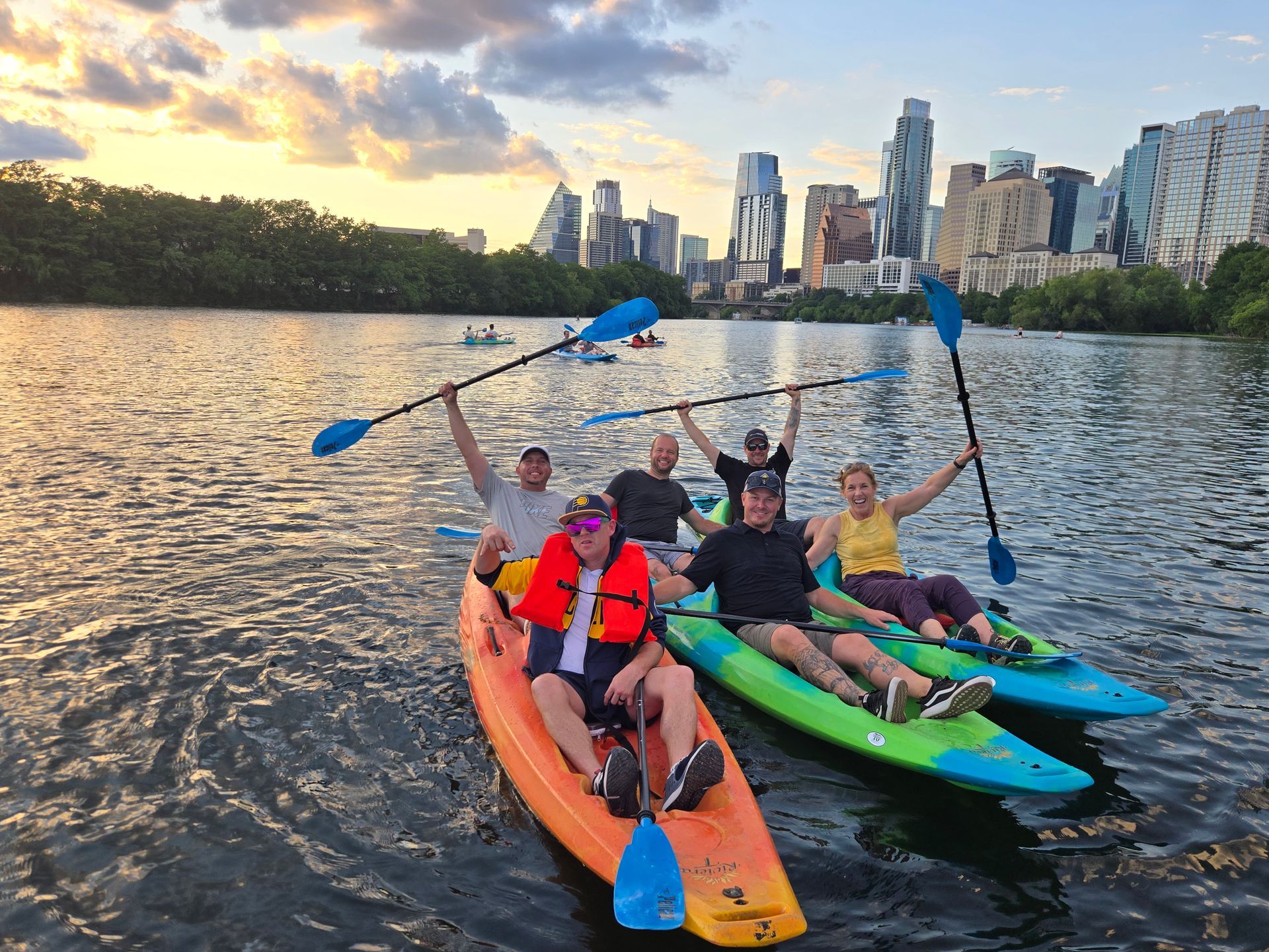 Private paddle tour group on Lady Bird Lake with Austin skyline in background