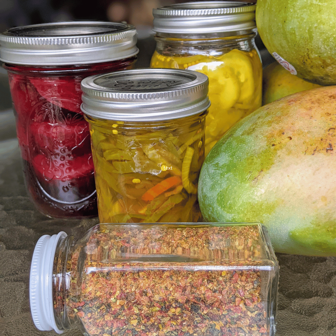three canning jars full of food and one jar lying on its side full of mixed spices