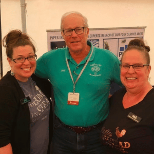 Miranda Johnson and Cammeron LaVecchia flanking Joel Salatin