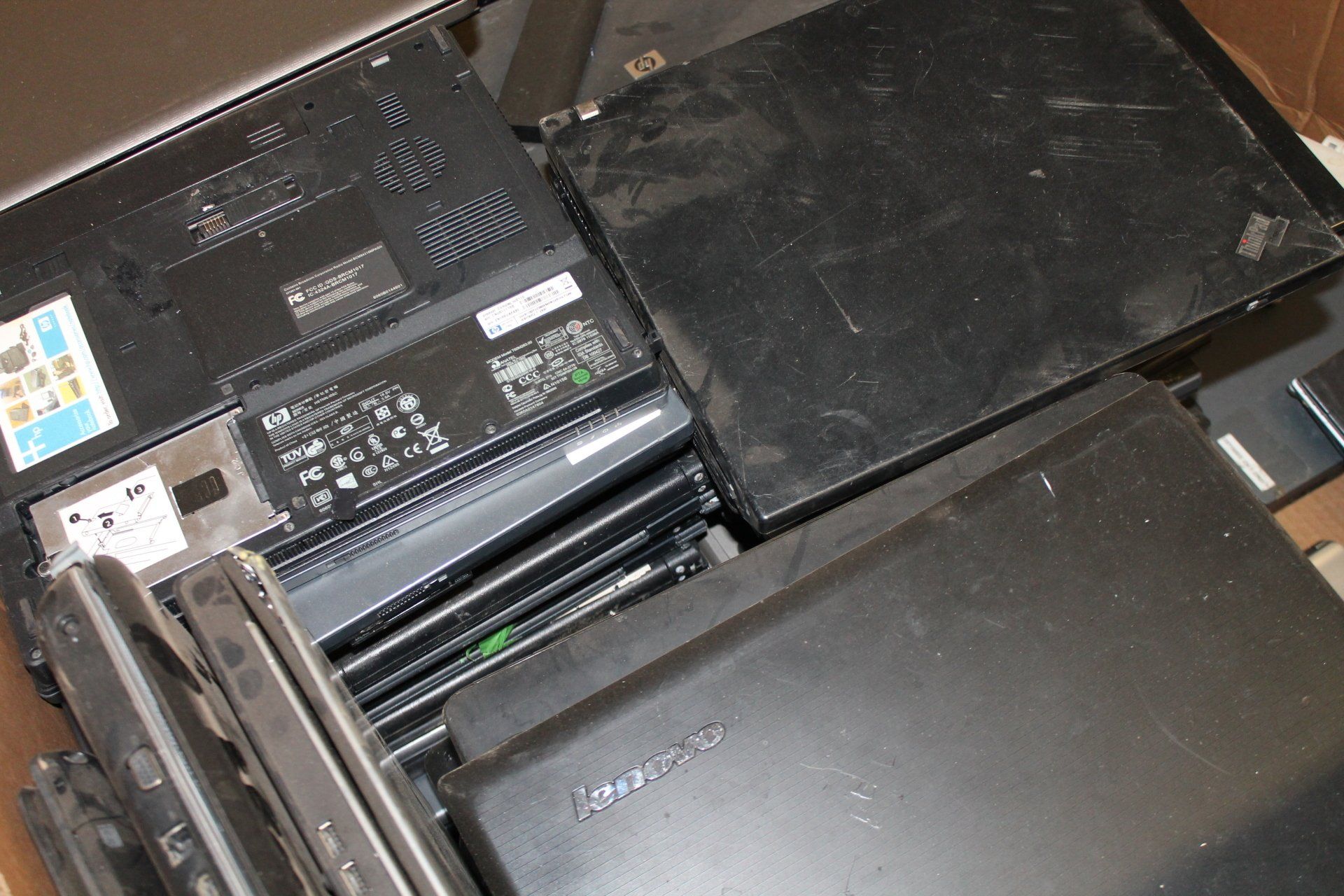 Close-up of a printer’s internal compartment with black panels and paper feed rollers
