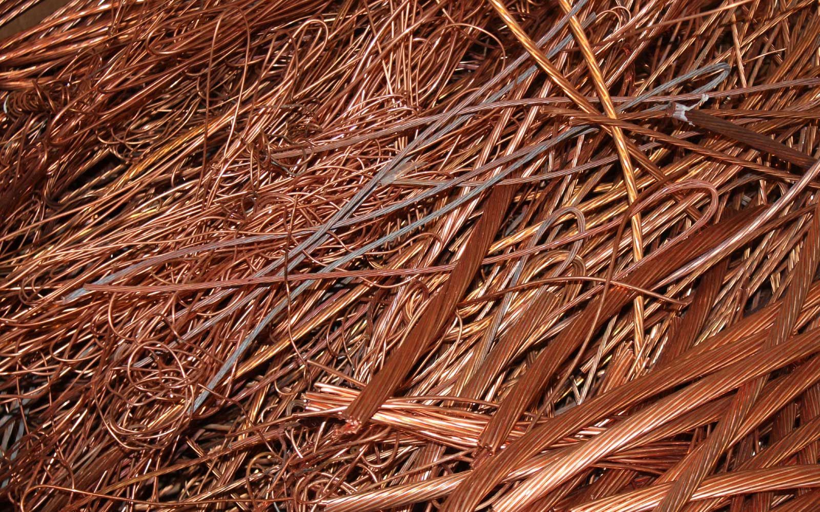 Close-up of tangled copper-colored wires or shredded metal strands