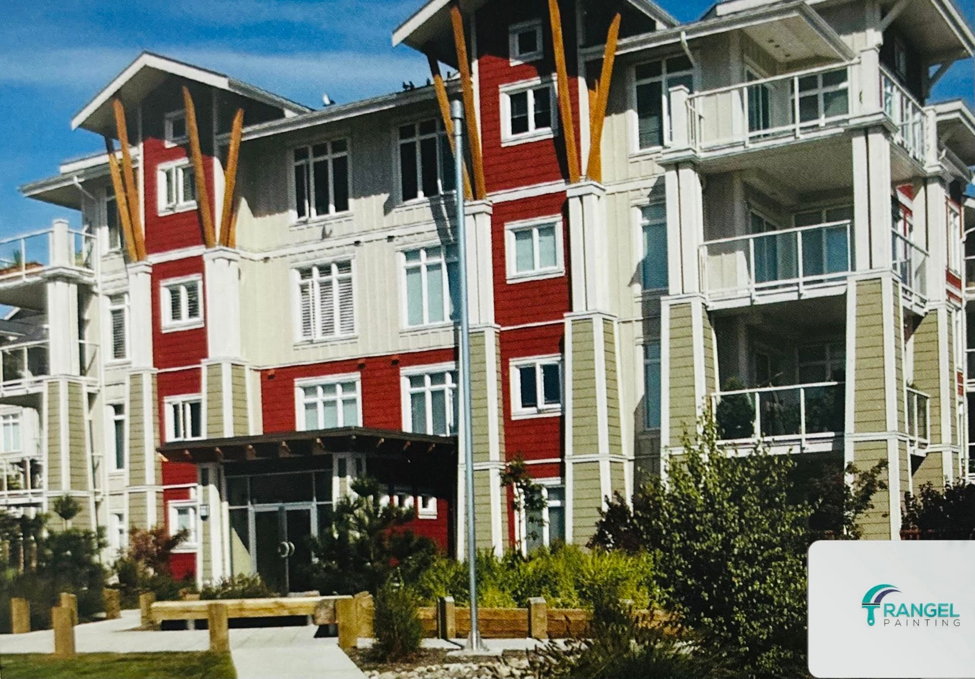 A large apartment building with a sign that says rangel