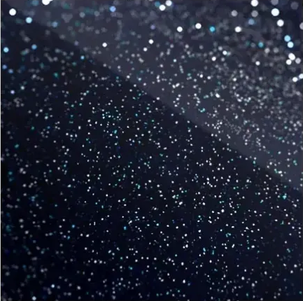 Dark fabric with scattered silver glitter, creating a sparkling abstract texture