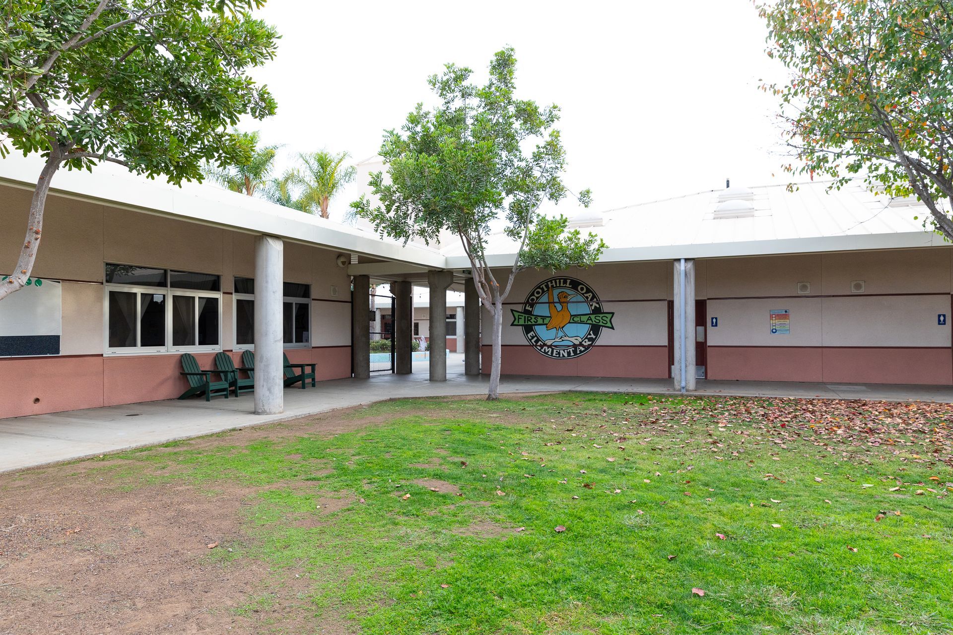 A school building with a clock on the side of it
