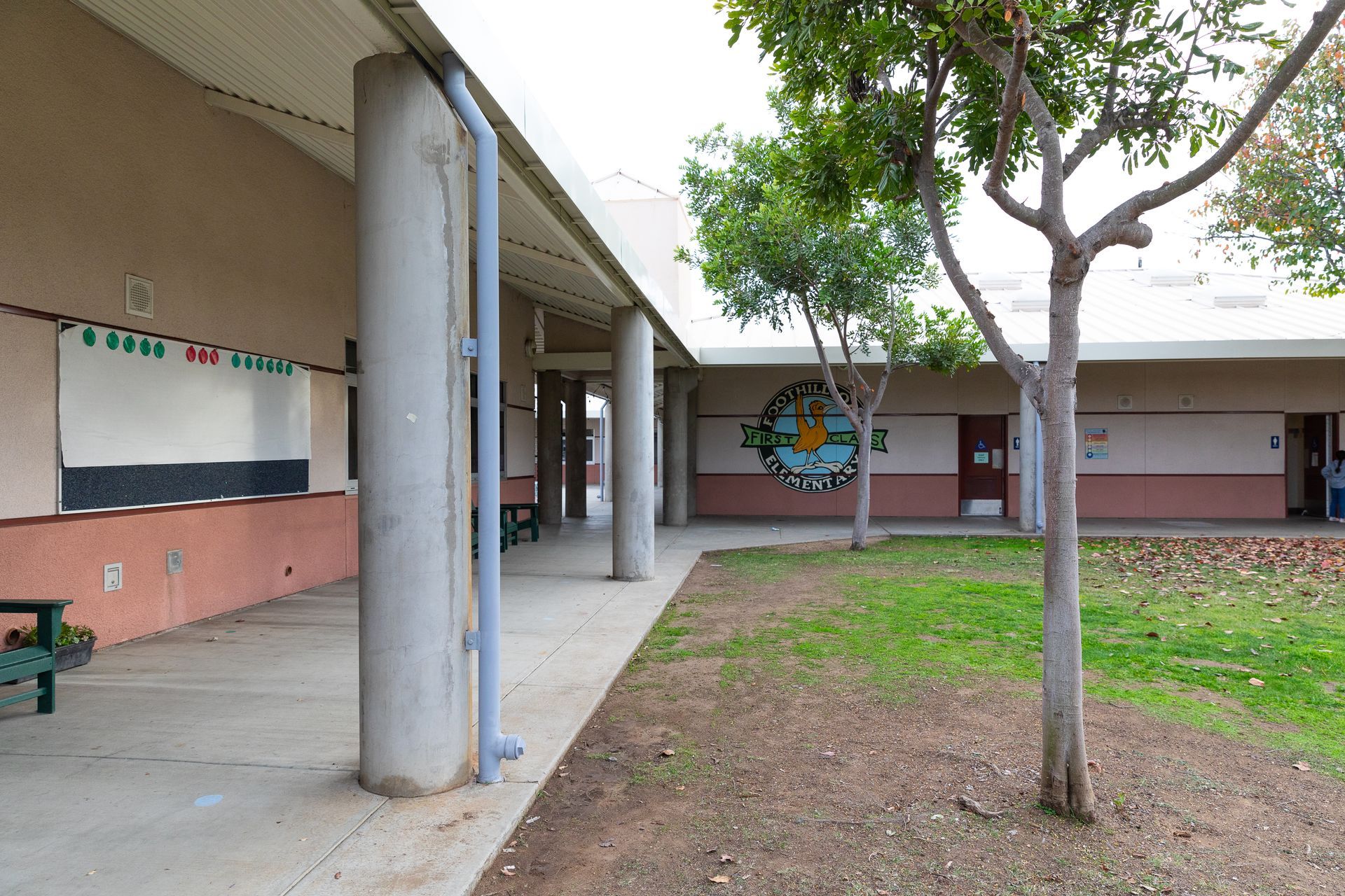 A school building with a clock on the side of it